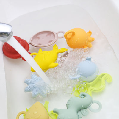 NUOVI bambini dei bambini di arrivo che fanno galleggiare i giocattoli liberi dell'acqua del silicone mettere i denti del commestibile di bpa dei giocattoli del silicone del bagno