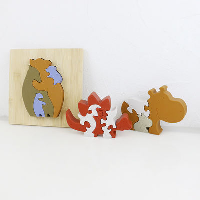 Personalizzi il puzzle del silicone, i puzzle infantili 3D con la base di bambù di legno