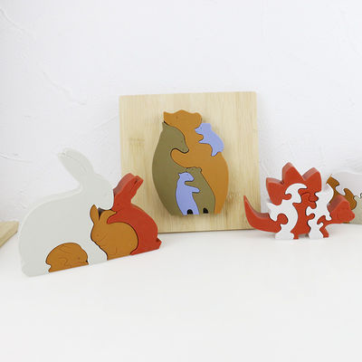 Personalizzi il puzzle del silicone, i puzzle infantili 3D con la base di bambù di legno