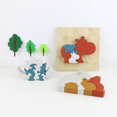 Personalizzi il puzzle del silicone, i puzzle infantili 3D con la base di bambù di legno