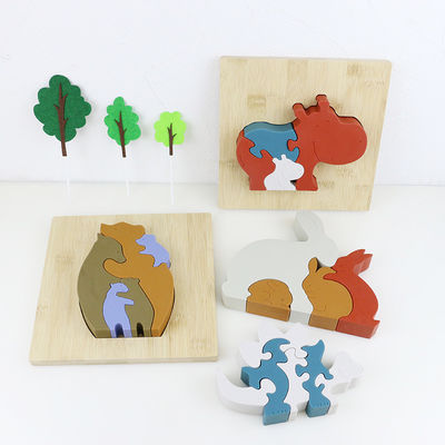 Personalizzi il puzzle del silicone, i puzzle infantili 3D con la base di bambù di legno