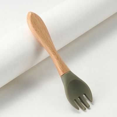 Commestibile le forchette ed i cucchiai del silicone termoresistenti con la maniglia di legno