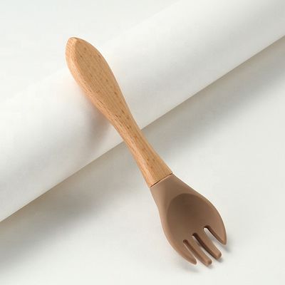 Commestibile le forchette ed i cucchiai del silicone termoresistenti con la maniglia di legno