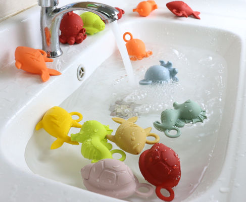 Il silicone di gomma del bambino di colori brillanti gioca BPA libero per il galleggiamento dell'acqua del bambino