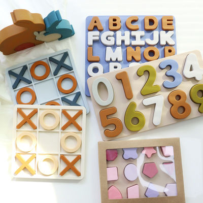 Ingrosso Puzzle XO in silicone personalizzato Logo Brand Bambino Puzzle di silicone didattico