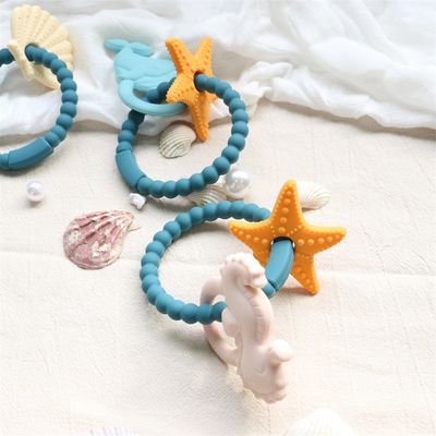 Teether per bambini in silicone di qualità alimentare con design non tossico e manica facile da impugnare