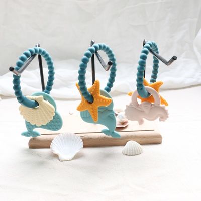 Teether per bambini in silicone di qualità alimentare con design non tossico e manica facile da impugnare